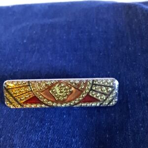 Elegant Gold and Red Brooch